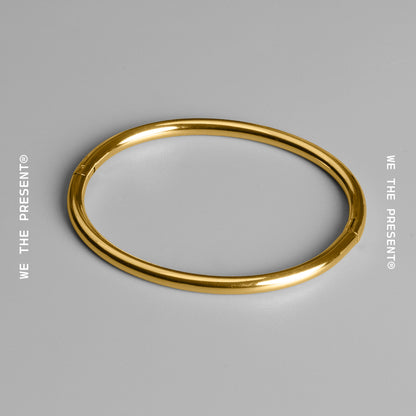 We The Present Tubular Closed Gold Bangle